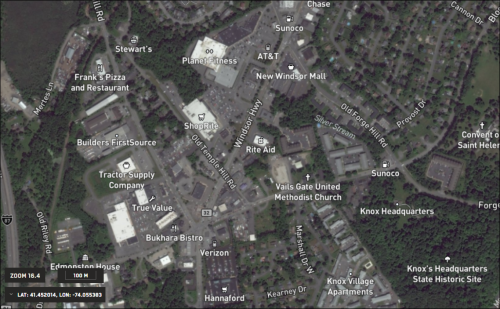 Map labels at zoom level 16.3. The map is zoomed in over a shopping center in Newburgh, New York. The map is zoomed in enough for map labels to indicate points of interest as detailed as residental streets, gas stations, and restuarants.